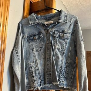 Jean jacket with some distressed designs